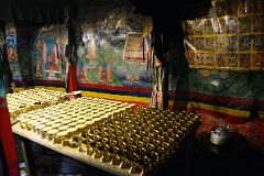 15 Butter Lamps And Painting Of Bhaisajyaguru Medicine Buddha In The Main Hall At Rong Pu Monastery Between Rongbuk And Mount Everest North Face Base Camp In Tibet.jpg